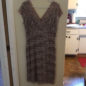 Stunning and flattering beige stretch lace dress.
